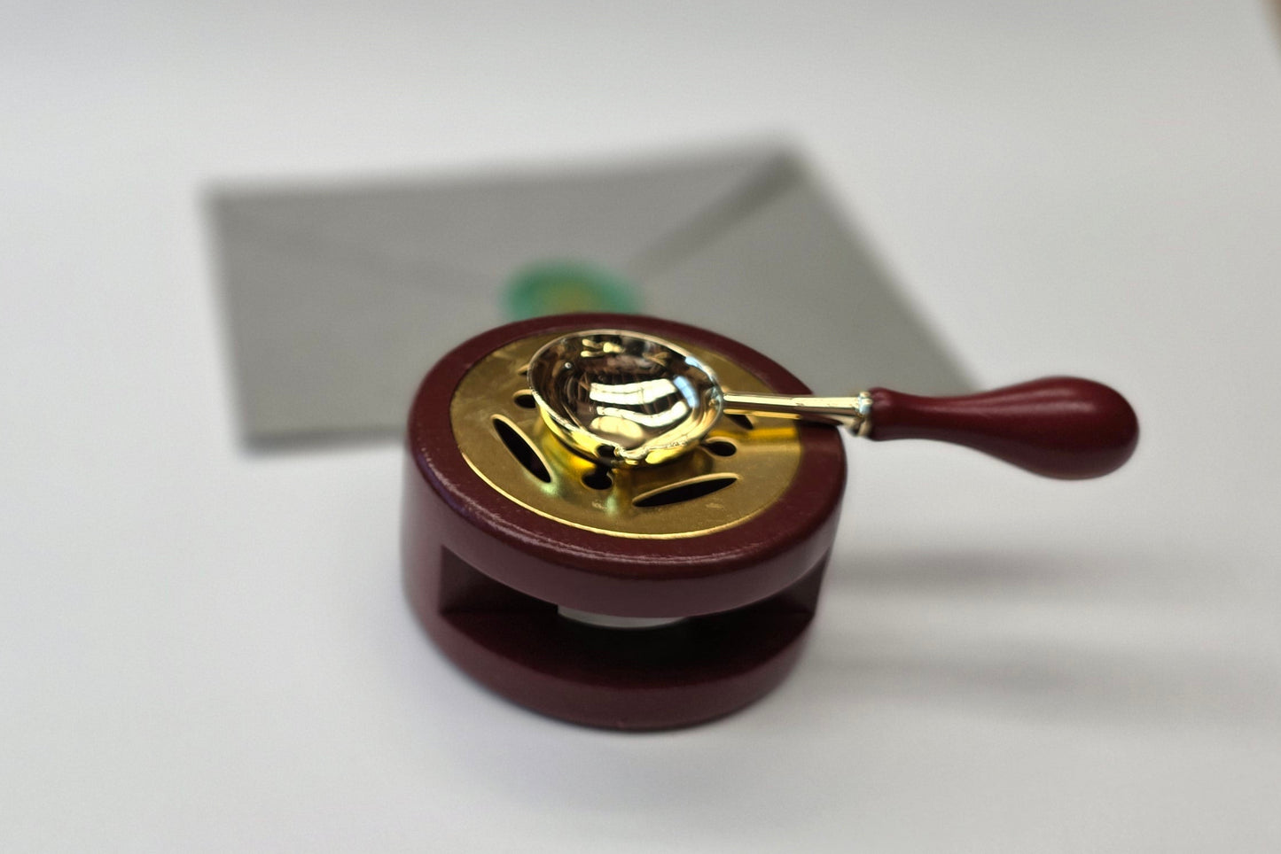 Brown sealing wax warmer and spoon