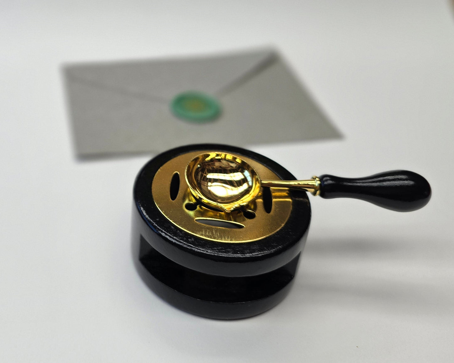 Gloss black sealing wax warmer with spoon
