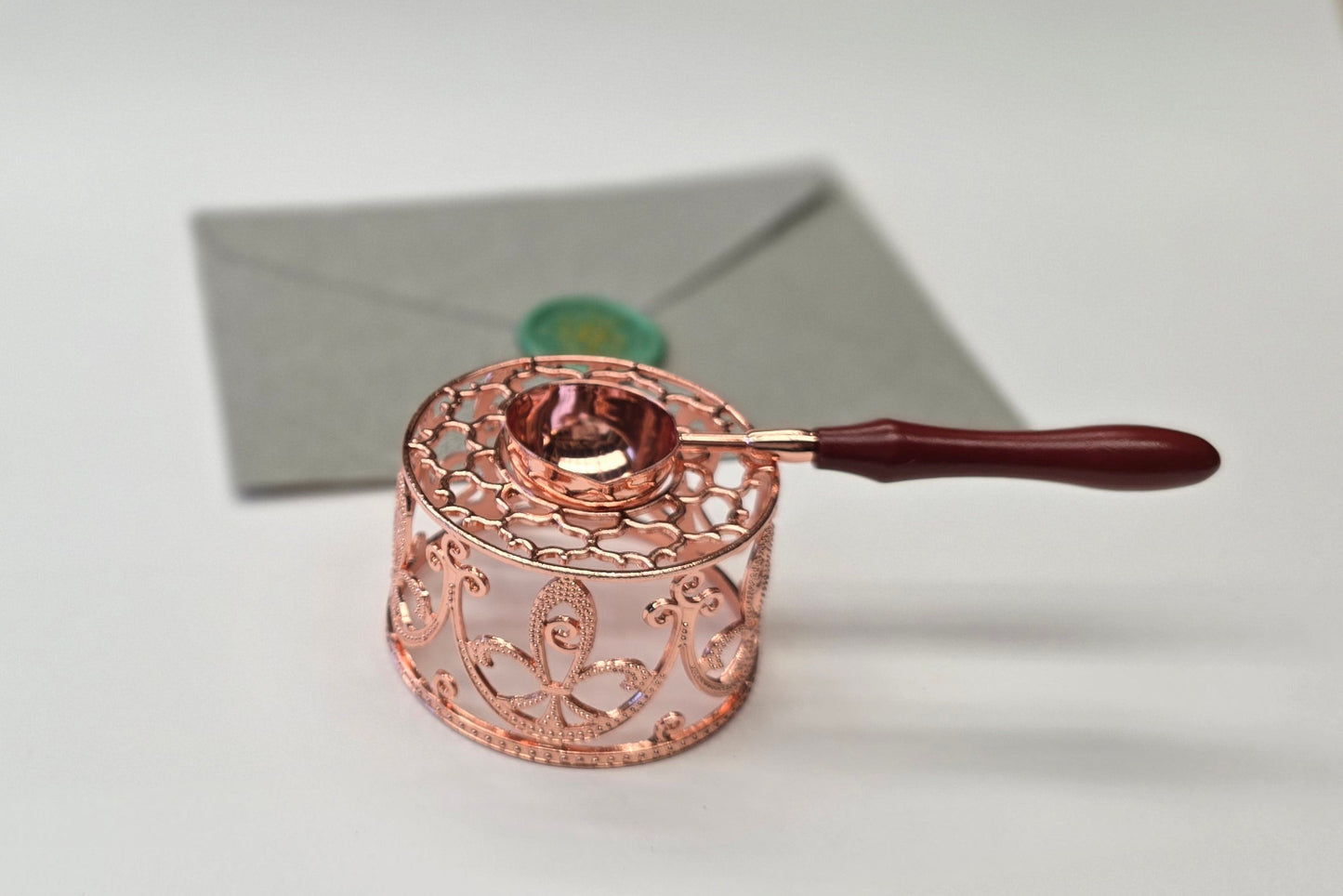 Rose gold sealing wax warmer and spoon