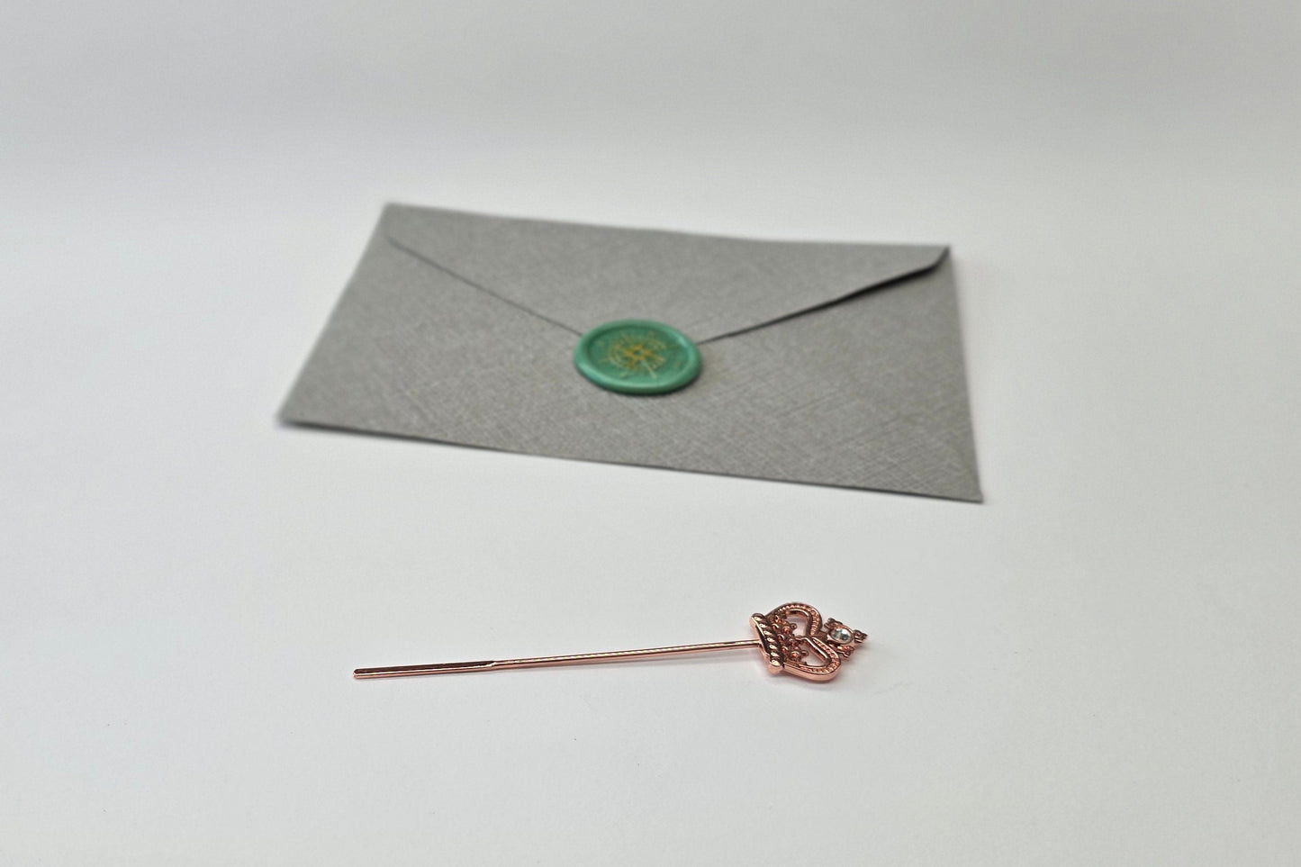 Rose gold crown stirring rod