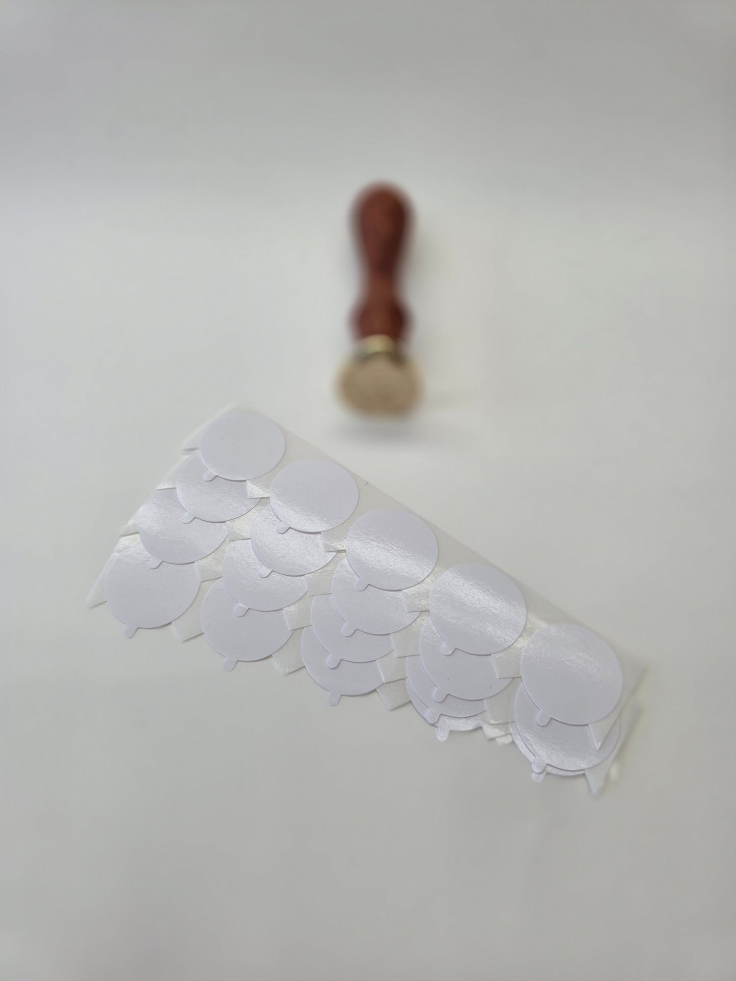 Double sided adhesives for wax seals