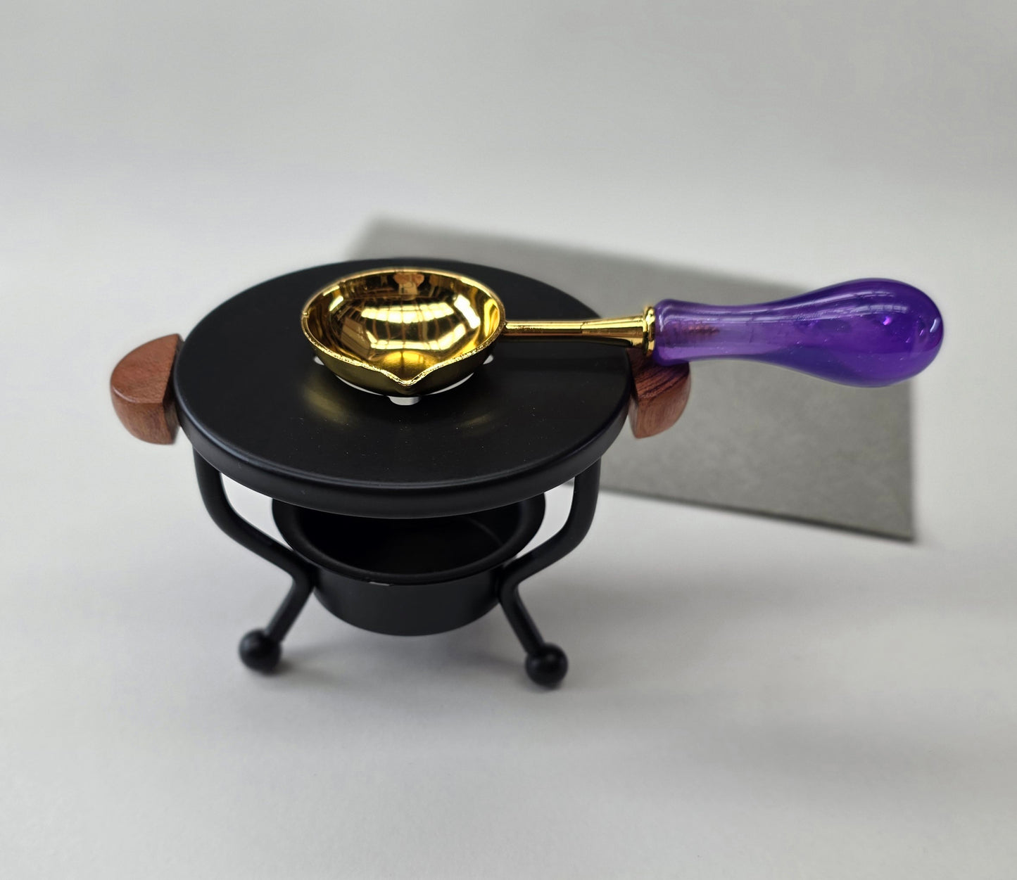 Black metal with wood handles warmer with spoon