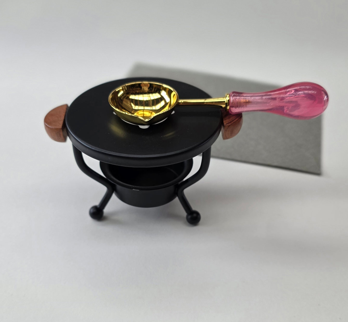 Black metal with wood handles warmer with spoon