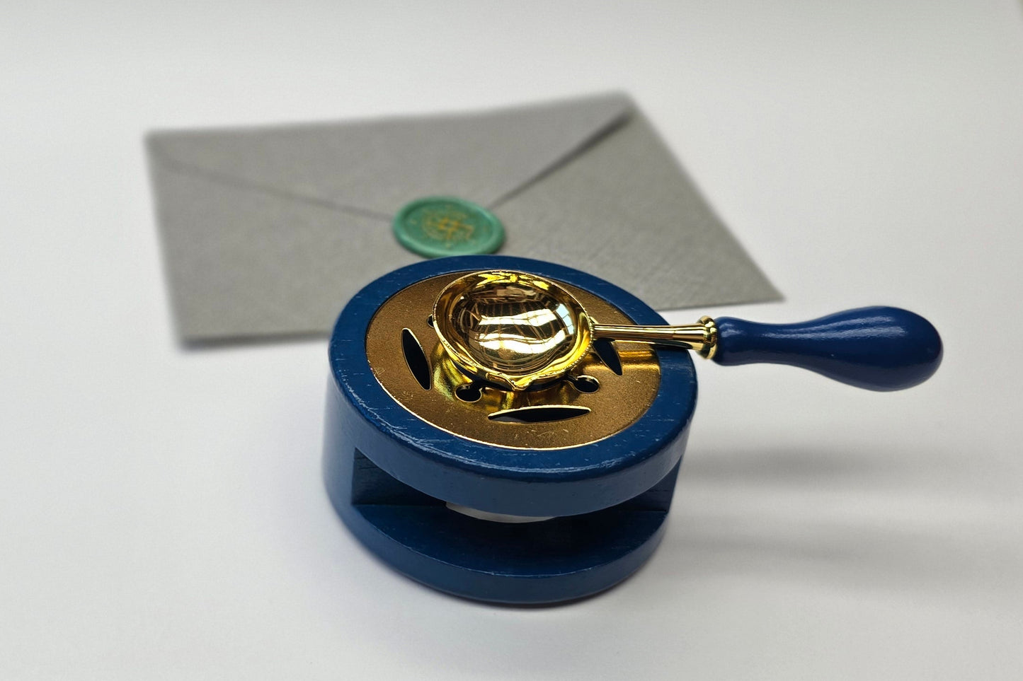 Blue sealing wax warmer and spoon