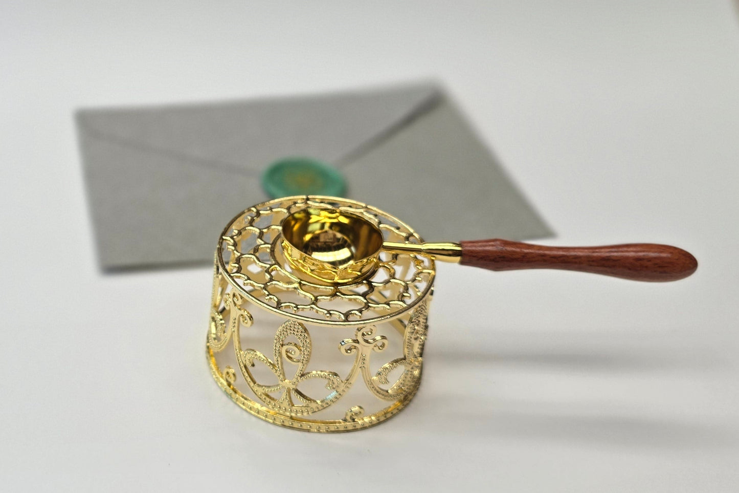 Gold sealing wax warmer and spoon